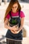 woman accurate holds pot with decorative green plant haworthia.