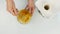 Woman adding honey to a nut butter and mixing ingredients in bowl. 4K