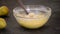 Woman adds chopped pear to the batter. Process of making delicious pear cake.