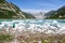 Woman admires ice and mountain beauty of McBride Inlet in Glacier Bay