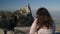 Woman is admiring Guaita tower on mount Monte Titano in San-Marino