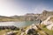 Woman admiring the views of Estanes lake during sunset