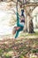 Woman aerial hoop dance in forest