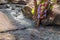 Woman in African outfit on the verge of fluent river. Interacting with water. Angola.