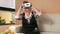 Woman aged acquainted with virtual reality goggles. She brings points to the head and twists in different directions