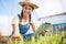 Woman, agriculture and tablet for gardening herbs, plants and check growth in greenhouse. Happy farmer, digital tech or