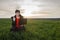 A woman agronomist examines planted young wheat