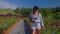 Woman agronomist inspecting blueberry plants