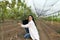 Woman agronomist in the orchard