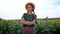 Woman agronomist standing agricultural sunflower field Caucasian female farmer straw hat Portrait agribusiness worker