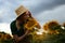 Woman agronomist standing agricultural sunflower field Caucasian female farmer straw hat Portrait agribusiness worker