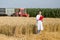 Woman agronomist in wheat field