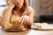 Woman allergic to gluten taking little bun with seeds