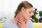 Woman with allergy redness on neck