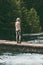 Woman alone standing on bridge over river wanderlust Travel Lifestyle