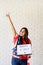 woman with american flag holding lightbox with words Happy 4 July