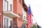 Woman with American flag near apartment building