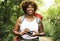 Woman with an analog camera in the forest