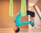 Woman on antigravity yoga exercise