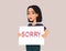 Woman Apologizing Holding a Sorry Sign Vector Cartoon Illustration