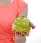 Woman with apple and measure tape