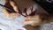 Woman applies a thin layer of protective gel to the fingernails with a brush