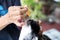 Woman applying antibiotic eye drops to dog`s eye