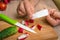 Woman is applying band aid plaster on her finger