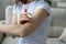 Woman applying cream on arm using natural treatment closeup view