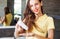 Woman applying dry shampoo on her hair