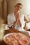 Woman Applying Hand Cream. Portrait Of Female In Silk Pajama At Home. Skincare Routine As Part Of Beauty Therapy.