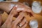 Woman Applying Homemade Hand Cream onto her Hands