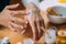 Woman Applying Homemade Hand Cream onto her Hands