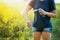 Woman applying insect repellent before forest hike beautiful sum