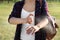 Woman applying insect repellent onto arm outdoors, closeup