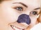 Woman applying pore strips on nose