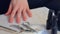 Woman is applying primer on nails before cover it shellac gel polish, closeup.