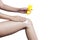 Woman applying sunscreen on her leg isolate on white background