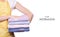 Woman in apron in hands stack towels laundry clothes pattern