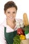 Woman in apron holding grocery bag