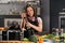 Woman in apron on modern kitchen