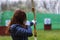 Woman archer shooting with his bow at an outdoor