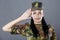 Woman army soldier saluting