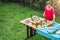 Woman arranging food on a wooden table