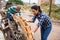 Woman arranging wooden pallets in backyard