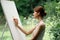 woman artist nature easel drawing creative landscape