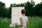 woman artist outdoors easel drawing creative landscape