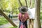 Woman artist wearing big hat at the plein air in the city park