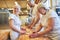 Woman as a baker`s apprentice kneading the dough under supervision