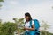 Woman Asia with backpack tourism. traveler in the forest and ma